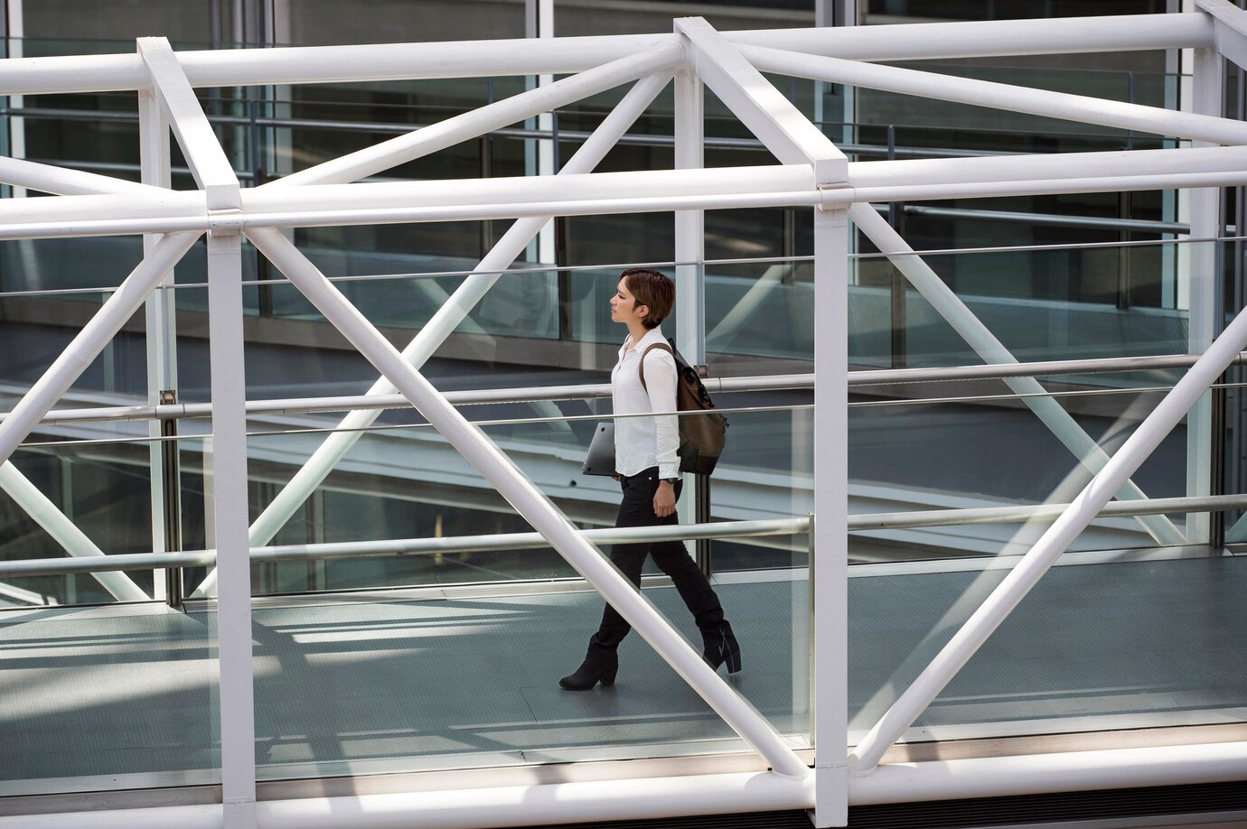 full-shot-woman-carrying-laptop-backpack_23-2148993855